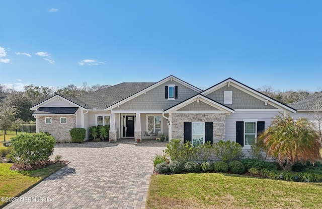 craftsman-style house with a front yard