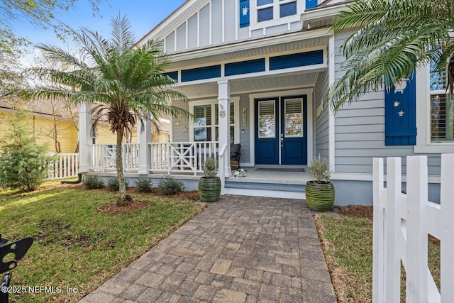 property entrance featuring covered porch