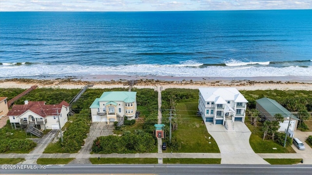 aerial view with a water view and a view of the beach