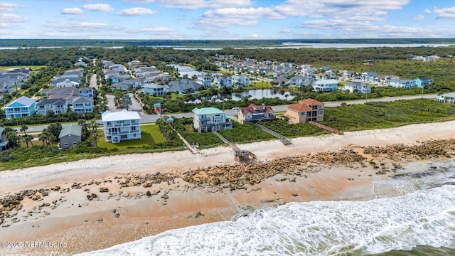 aerial view featuring a water view and a view of the beach