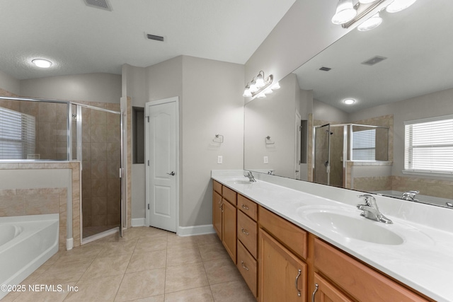 bathroom with tile patterned floors, plus walk in shower, and vanity