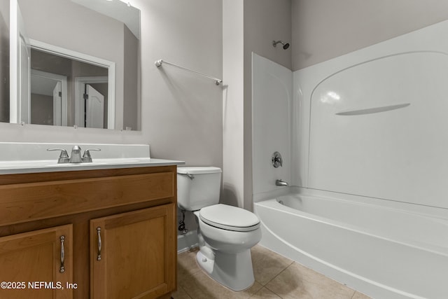 full bathroom featuring tile patterned flooring, vanity, tub / shower combination, and toilet