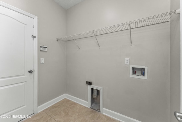 laundry area featuring washer hookup, electric dryer hookup, and light tile patterned floors