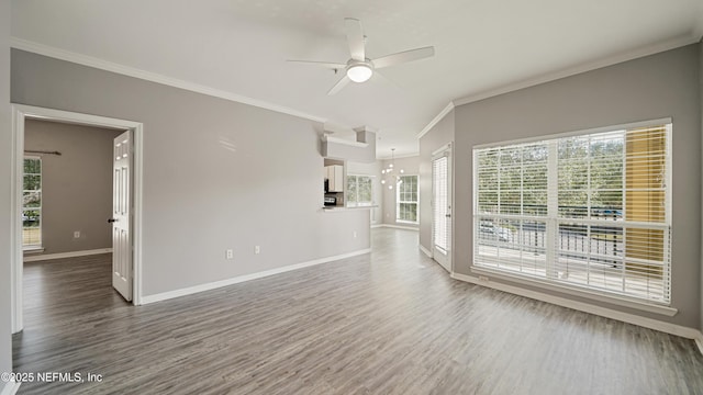 unfurnished living room with hardwood / wood-style flooring, ceiling fan, and crown molding