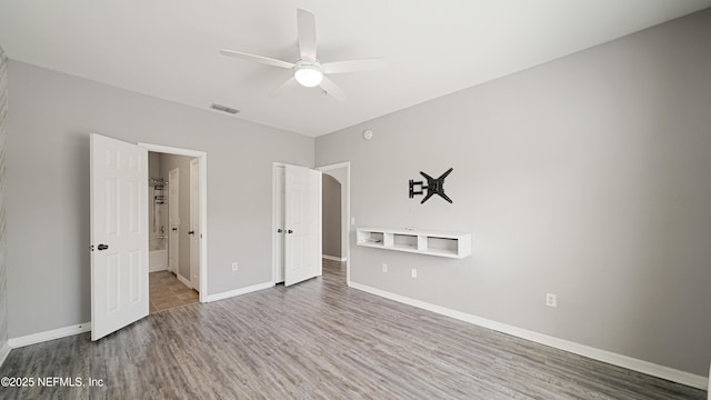 unfurnished bedroom with wood-type flooring and ceiling fan