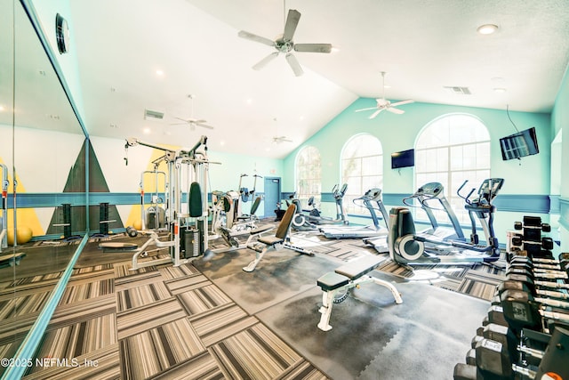 gym with lofted ceiling and carpet