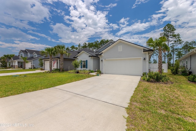 ranch-style home with a garage and a front yard