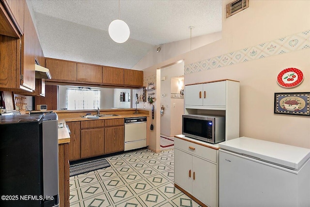 kitchen with sink, white cabinetry, refrigerator, white dishwasher, and pendant lighting