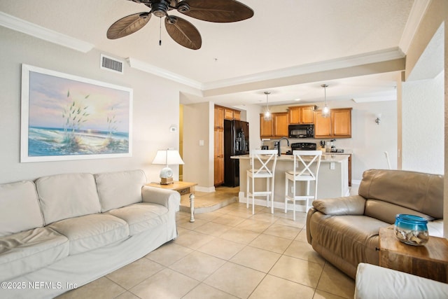 living room with light tile patterned floors, crown molding, sink, and ceiling fan