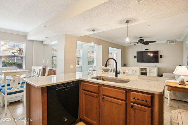 kitchen with dishwasher, sink, hanging light fixtures, light tile patterned floors, and light stone countertops