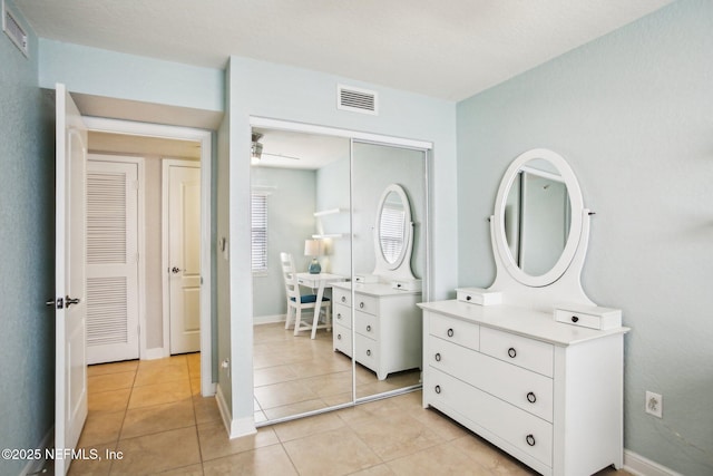 bathroom featuring vanity, tile patterned floors, and ceiling fan