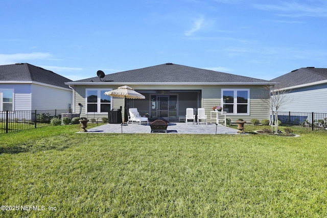 rear view of property featuring central AC, a yard, an outdoor fire pit, a patio, and a sunroom