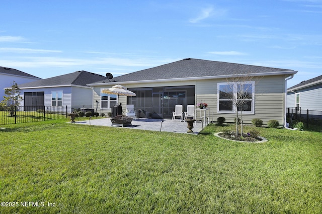 rear view of house featuring a patio area, fence, and a lawn