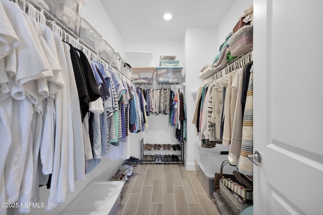 spacious closet with wood tiled floor