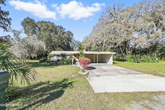 view of front of property with a carport, concrete driveway, and a front yard