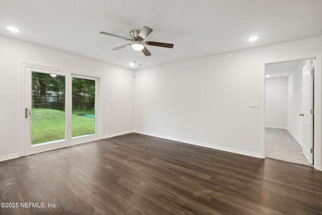 unfurnished room featuring dark hardwood / wood-style flooring and ceiling fan