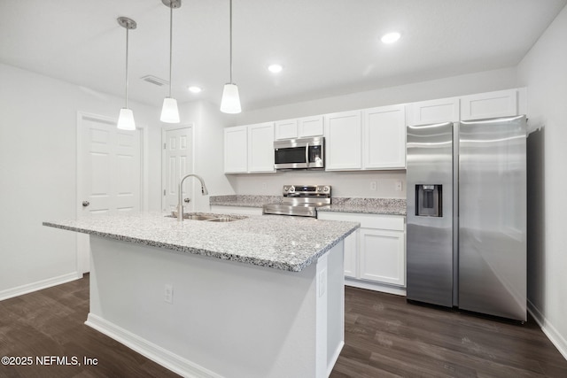 kitchen with stainless steel appliances, sink, and white cabinets