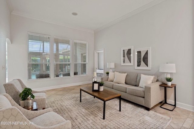 living area featuring light tile patterned floors, ornamental molding, and baseboards