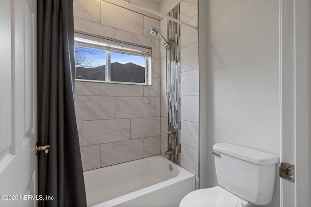 bathroom featuring toilet and shower / tub combo