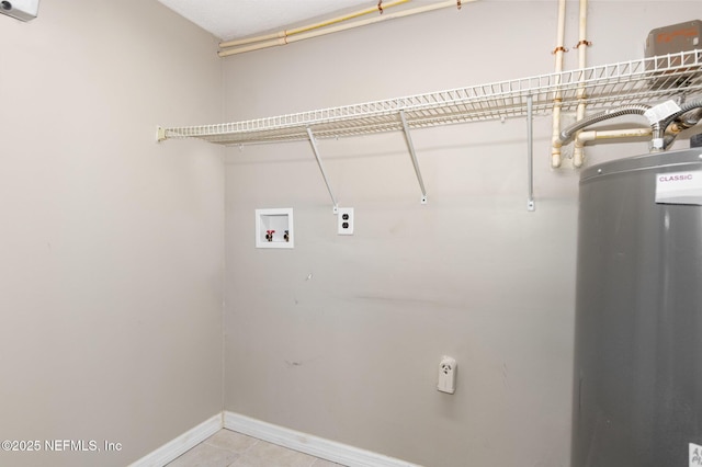 clothes washing area with gas water heater, electric dryer hookup, washer hookup, and light tile patterned floors