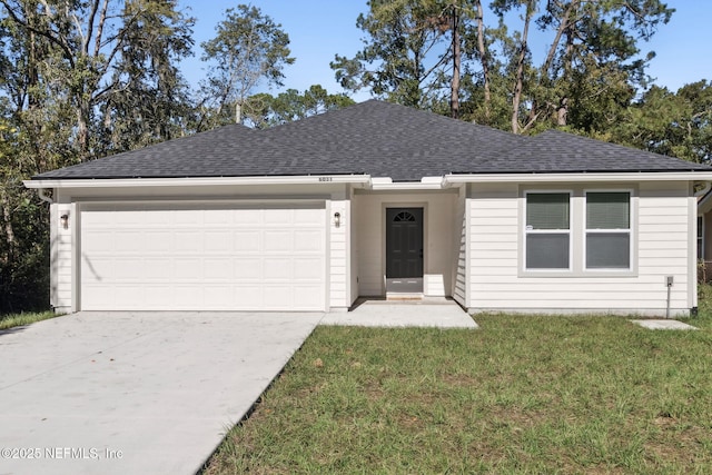 single story home featuring a garage and a front lawn