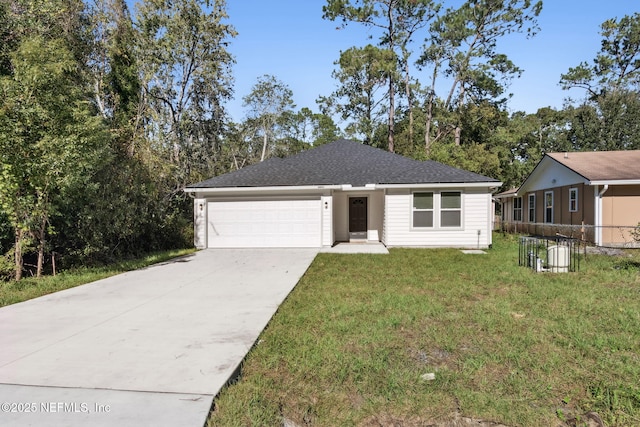 view of front of house featuring a garage and a front yard