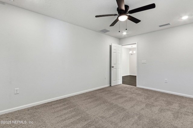 empty room with carpet floors and ceiling fan