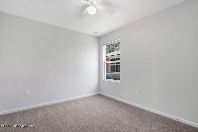 unfurnished room featuring carpet floors and ceiling fan