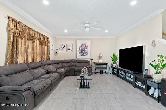 living room with ornamental molding and ceiling fan