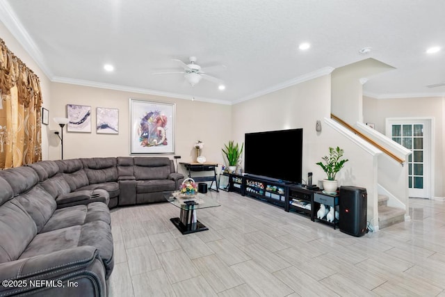 living room featuring ornamental molding and ceiling fan