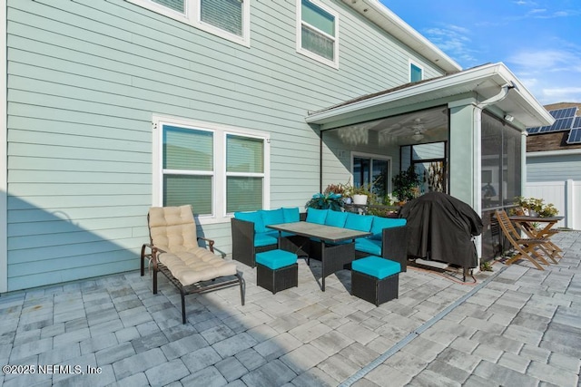 view of patio / terrace with ceiling fan, outdoor lounge area, area for grilling, and a sunroom