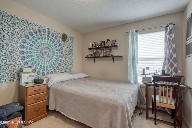 carpeted bedroom featuring a textured ceiling