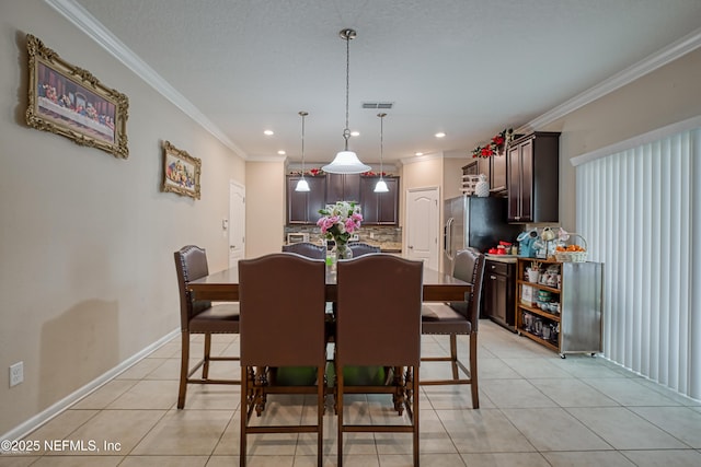 tiled dining area with crown molding