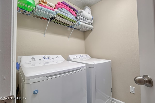 laundry area with washing machine and dryer