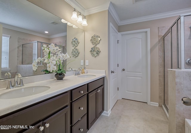 bathroom featuring crown molding, vanity, tile patterned floors, and a shower with shower door