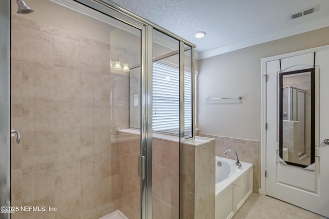 bathroom featuring crown molding, shower with separate bathtub, and a textured ceiling