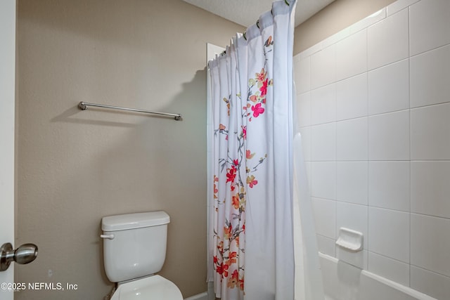 bathroom with toilet and shower / tub combo