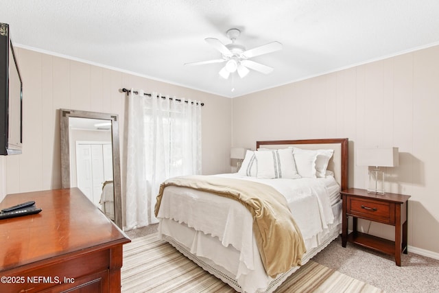 bedroom with crown molding and ceiling fan