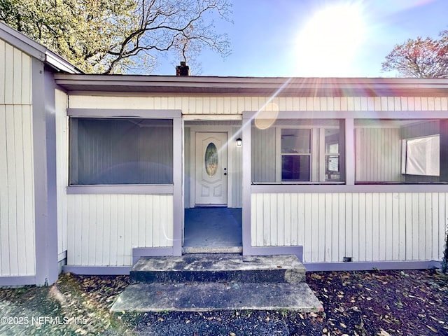 entrance to property featuring covered porch