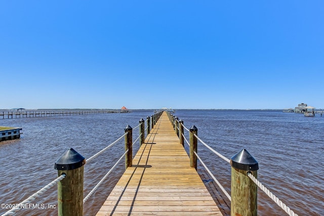 view of dock with a water view