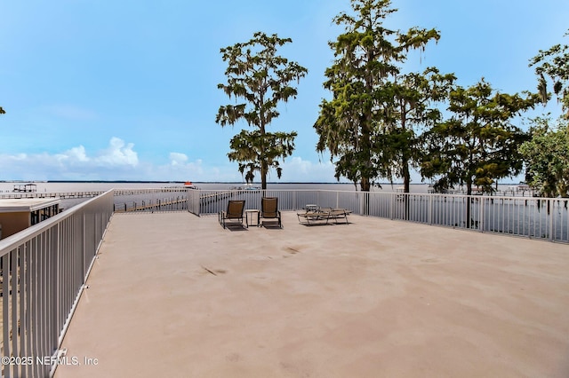 view of patio with a water view