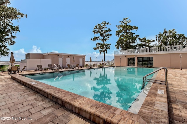 view of swimming pool with a patio