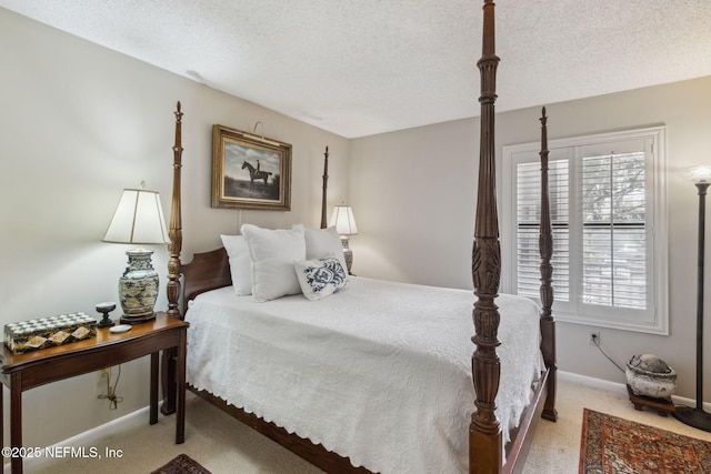 bedroom featuring light colored carpet and a textured ceiling