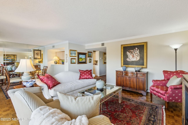 living room with ornamental molding, dark parquet floors, and a textured ceiling