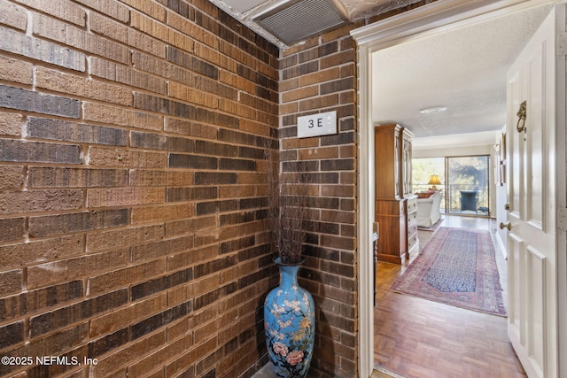 bathroom featuring brick wall