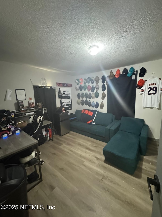 office space with hardwood / wood-style floors and a textured ceiling