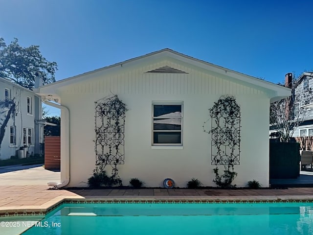 rear view of property featuring a patio