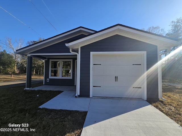 view of front of property featuring a garage and a porch