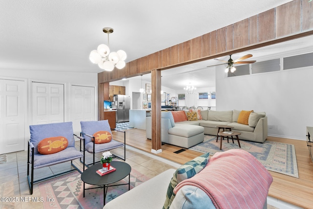 living room featuring an inviting chandelier and light hardwood / wood-style flooring