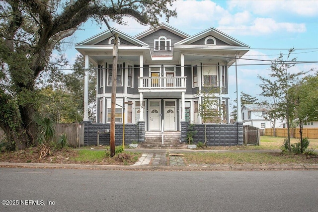 view of front of house featuring a balcony